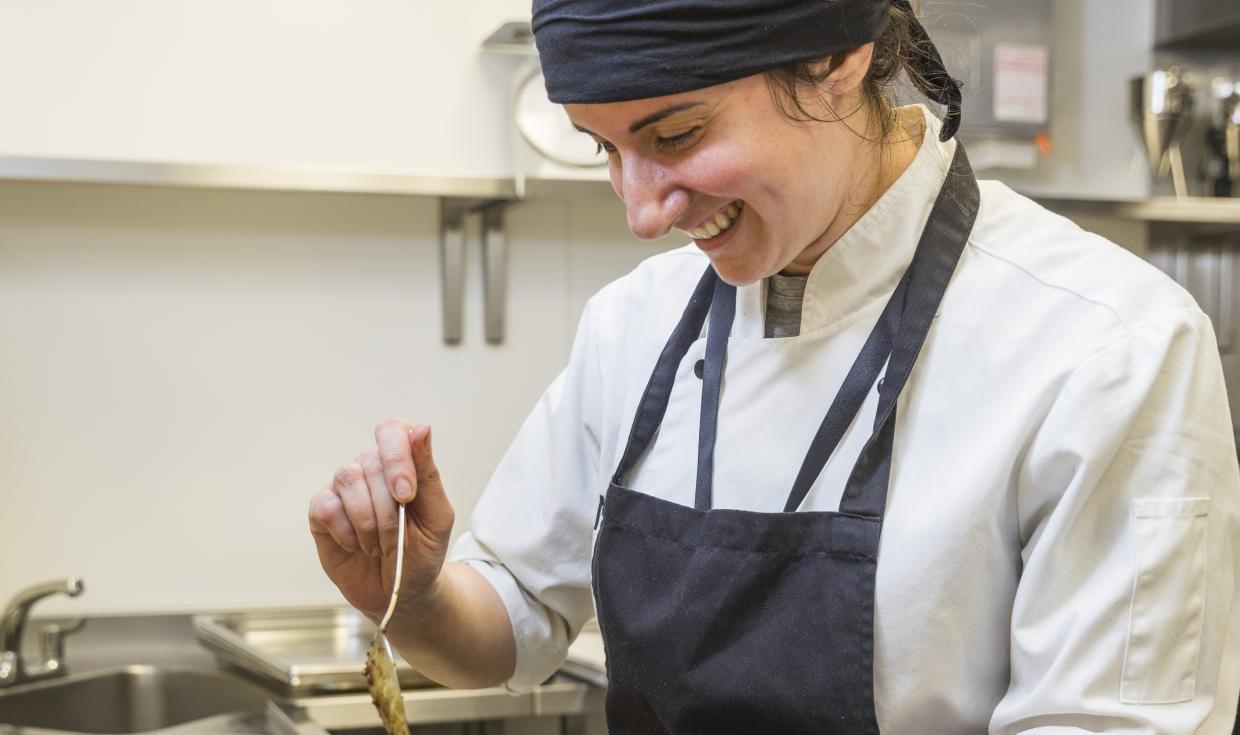 Pastry Chef assembling food in the kitchen