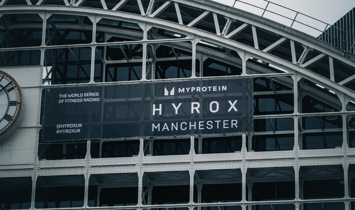 HYROX large scale sign displayed on the front gable of Manchester Central