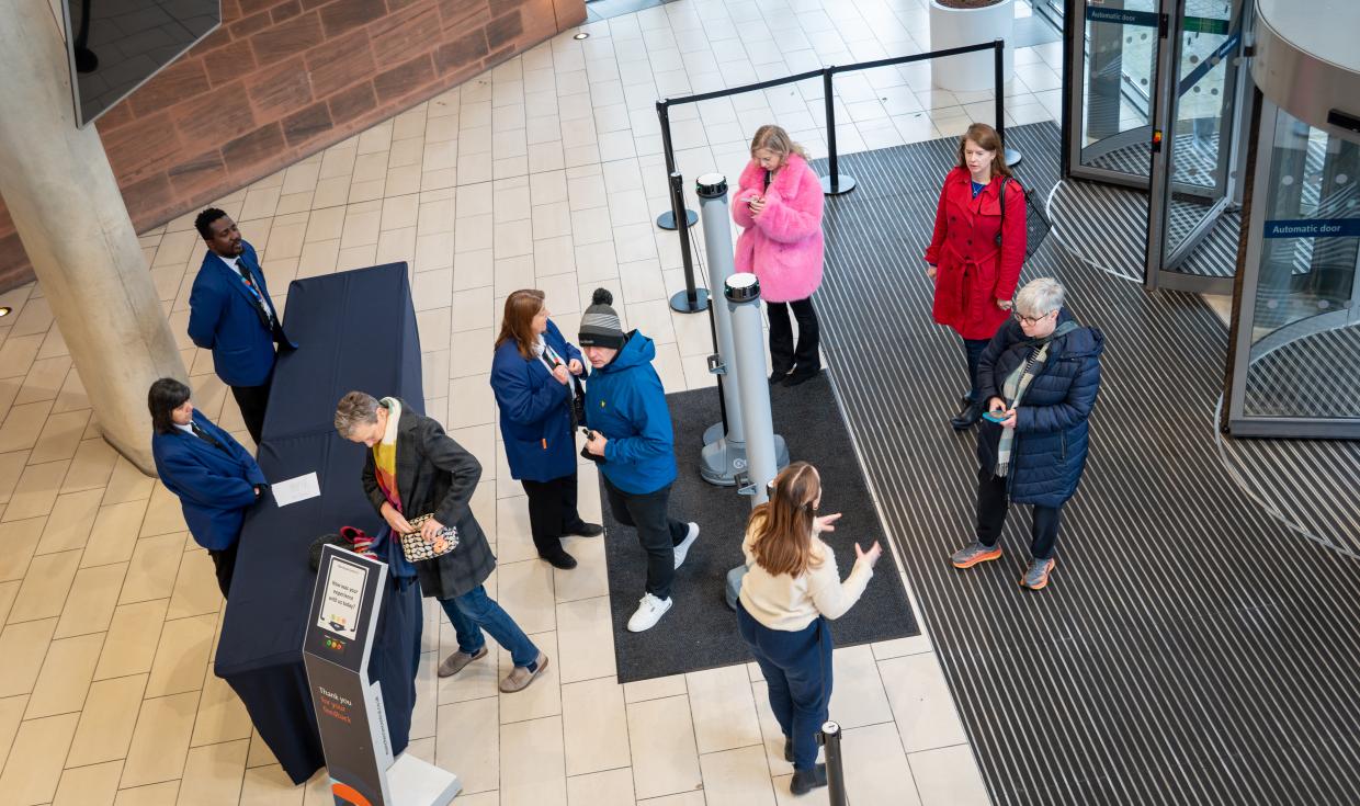 An aerial shot of Exchange Lower Foyer as attendees are welcomed through the doors.